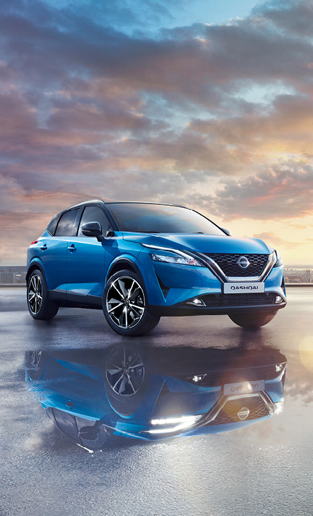 Blue Nissan Qashqai in parking lot