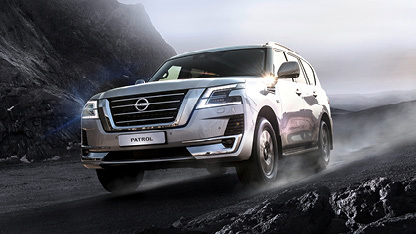 Nissan Patrol driving on wet mountain pass
