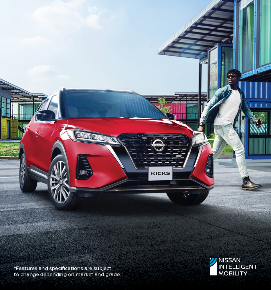 Red Nissan Kicks parked in front of a building